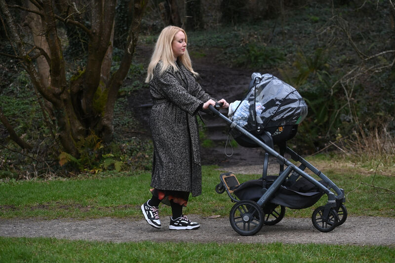  Julia Duff walking in The Glen River Park with her infant son Rian. Pic Larry Cummins