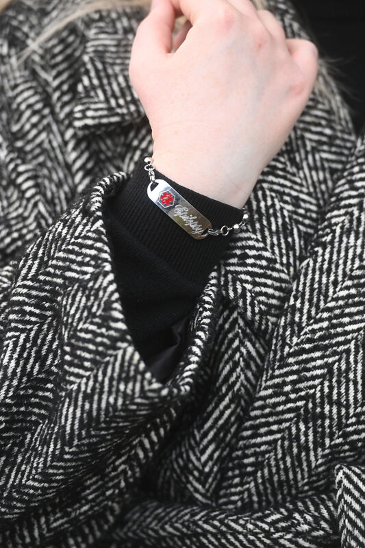 Medical Alert bracelet worn by Julia Duff to alert first responders or those giving emergency medical care. Pic Larry Cummins