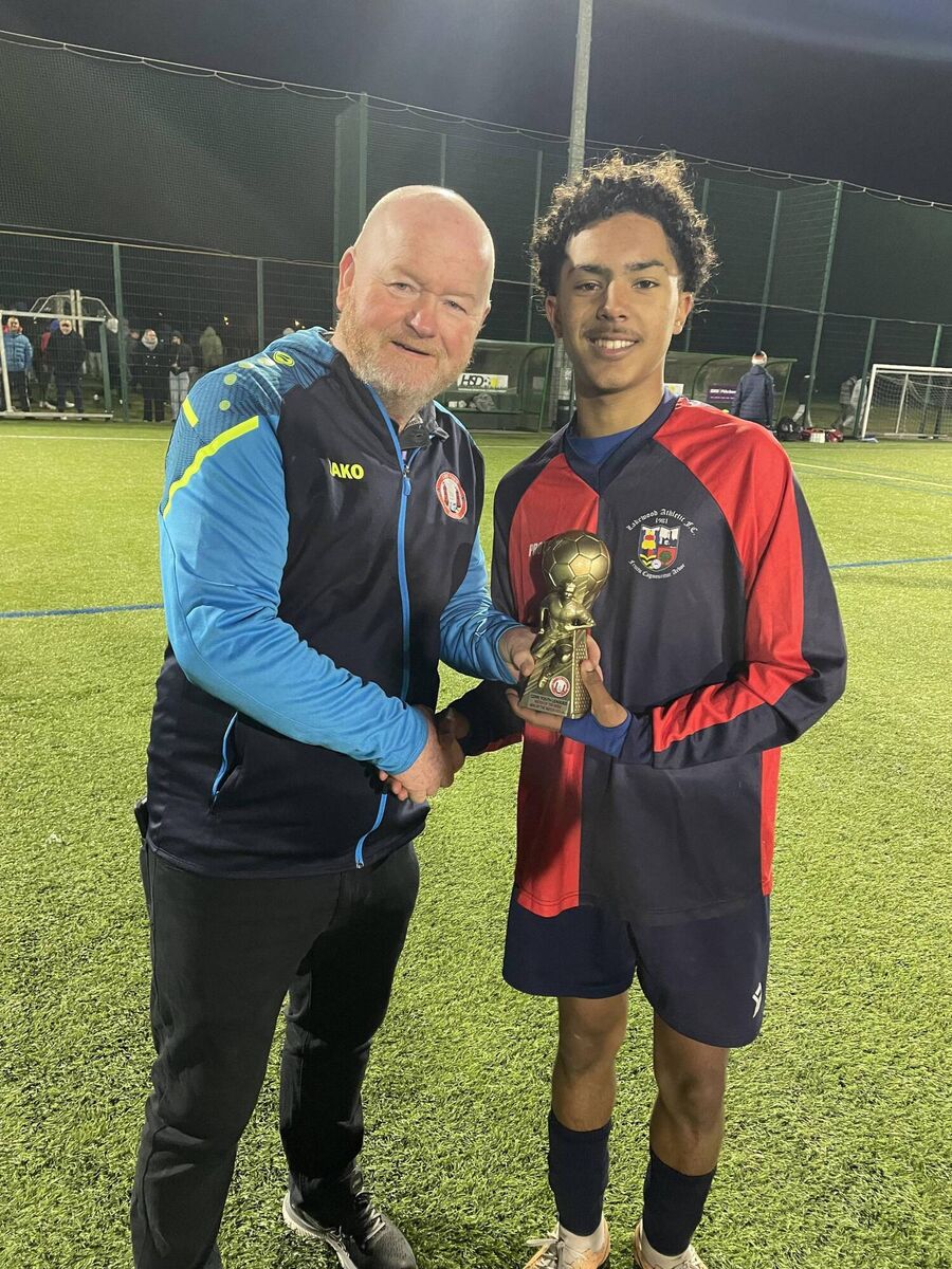 Denis Crowley from the Cork Youth League presenting the Gary McCarthy Trophies Man of the Match award to Lakewood Athletic’s star man Karim Fonseca after the U17 Gussie Walsh Cup semi-final against Ballincollig at Ovens recently.