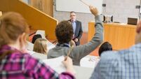 Students and teacher at the lecture hall