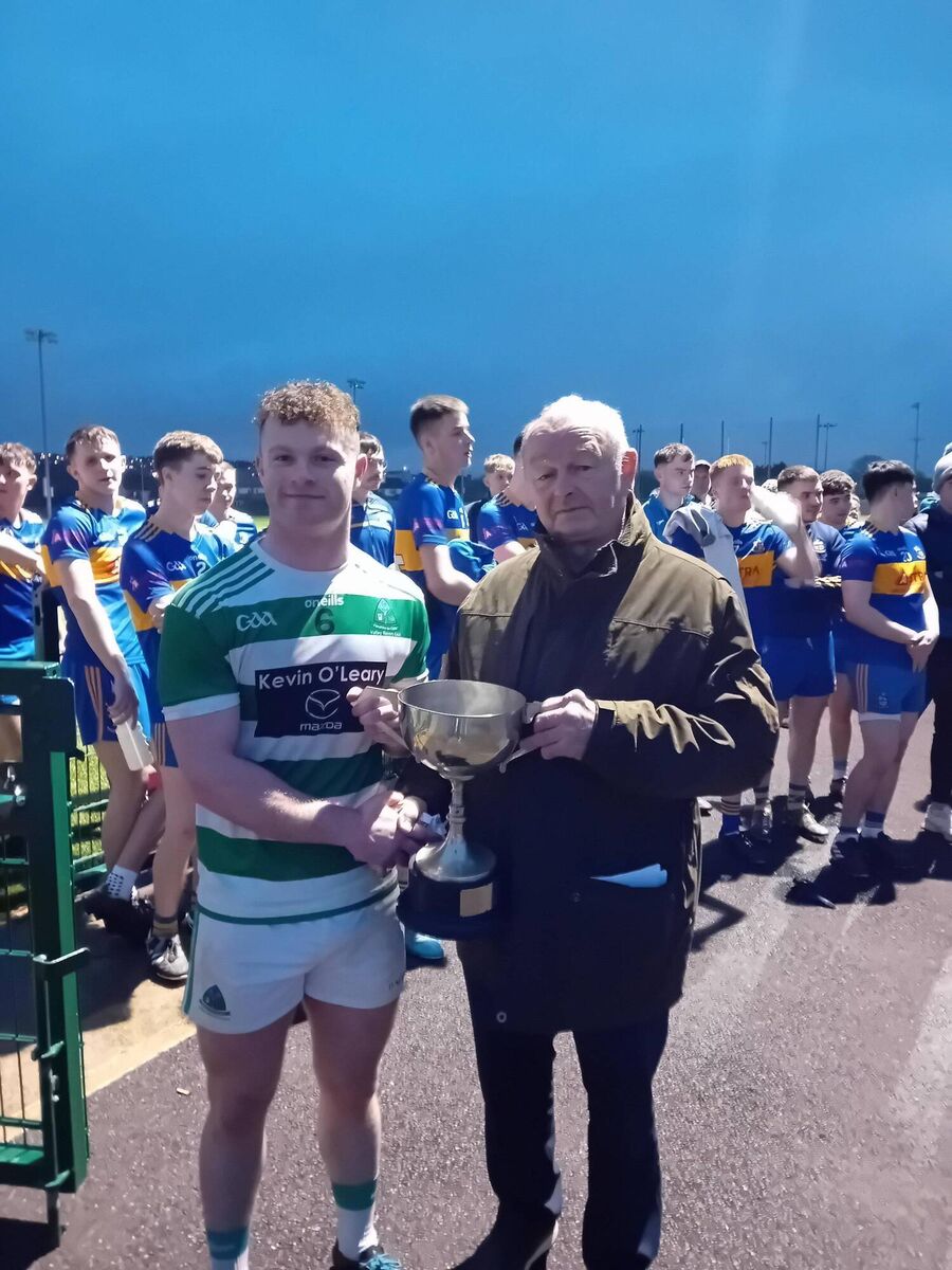 Chairman of the Carrigdhoun Division Myles Barry presenting the U21A Football Championship Trophy to Valley Rover's Captain Jonathan Kenneally on Saturday last Chairman of the Carrigdhoun Division Myles Barry presenting the U21A Football Championship Trophy to Valley Rover's Captain Jonathan Kenneally on Saturday last