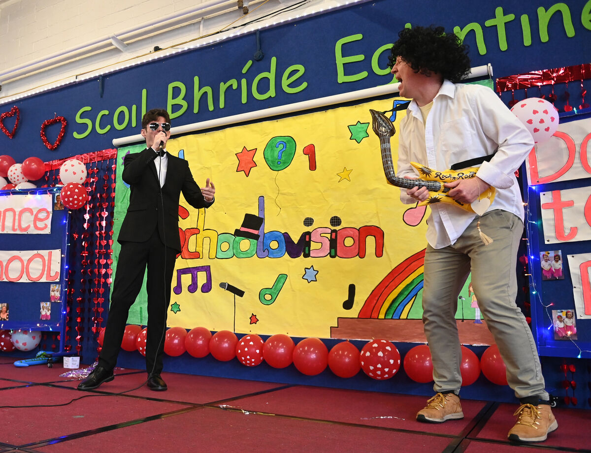 Guest performer Aaron Kelly as 'Harry Styles' with Andrew Robinson on (inflatable) guitar at the Scoil Bhríde Eglantine annual Schoolovision Song Contest. Pic: Larry Cummins