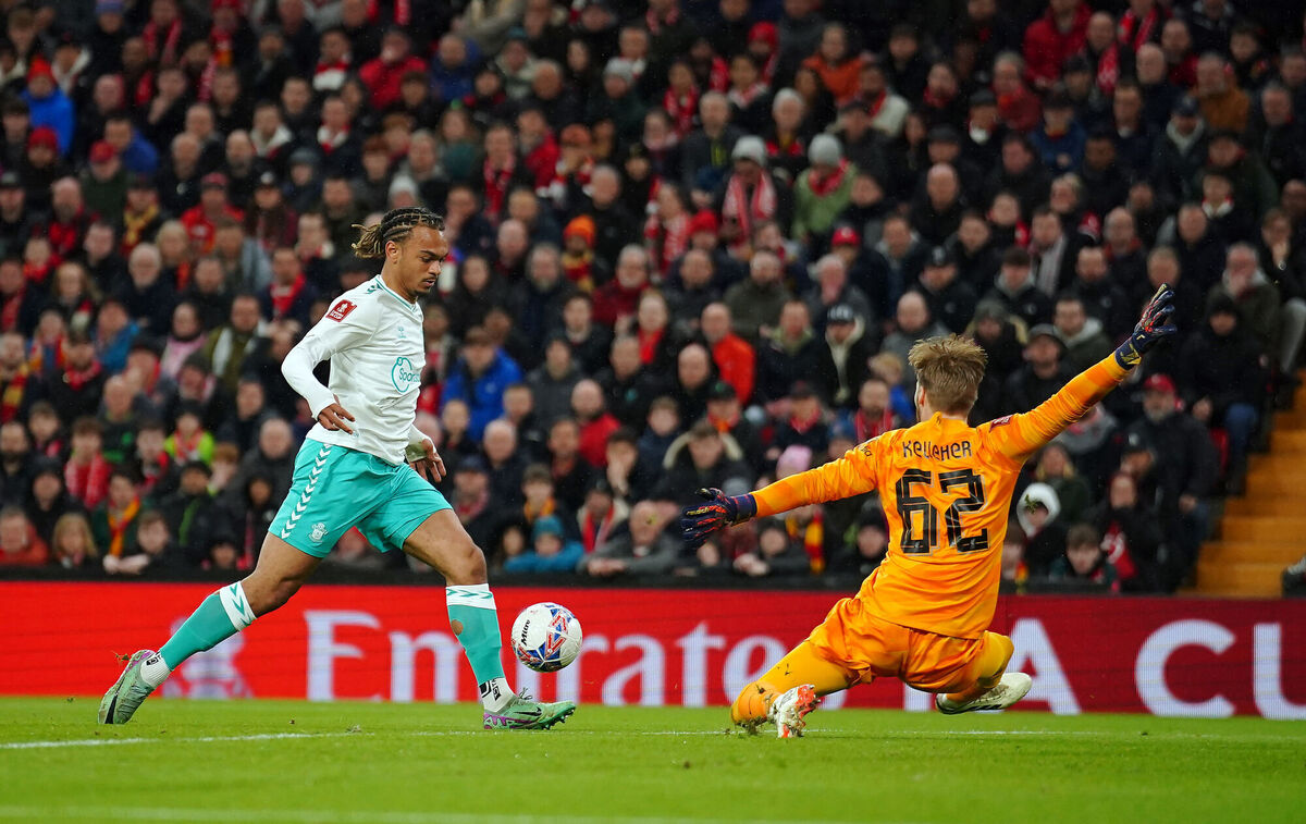 Liverpool goalkeeper Caoimhín Kelleher saves from Southampton's Sekou Mara during the Emirates FA Cup fifth round match at Anfield, Liverpool. Picture: Peter Byrne/PA Wire.
