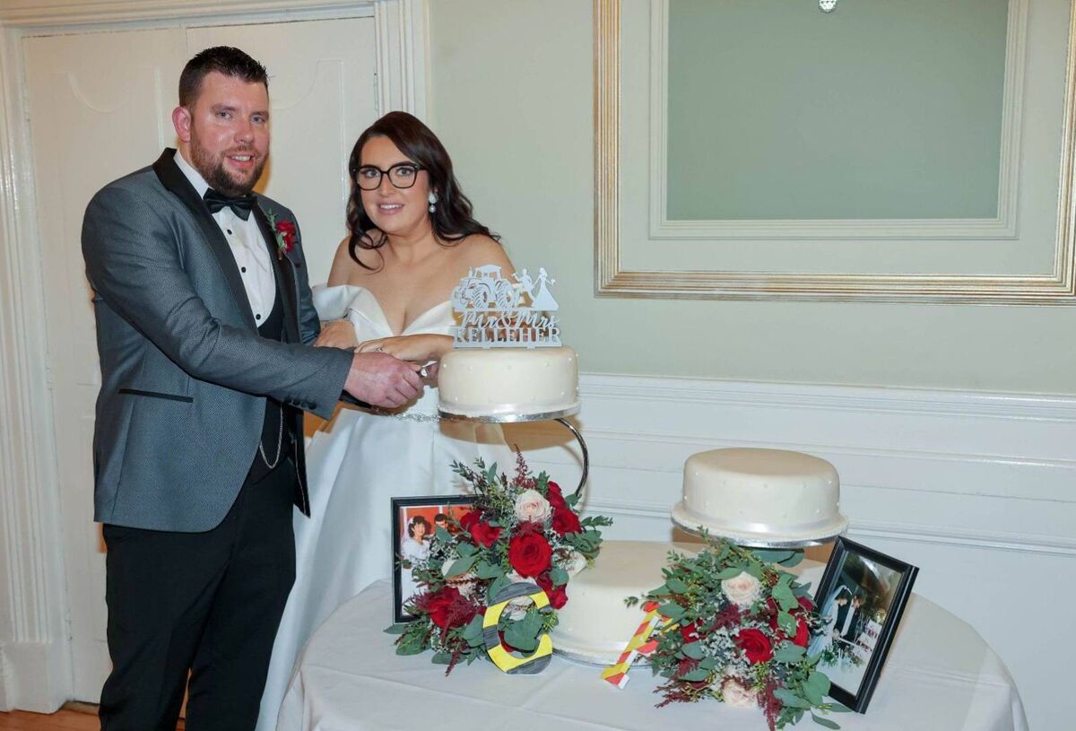 The couple cutting the cake. The couple cutting the cake.