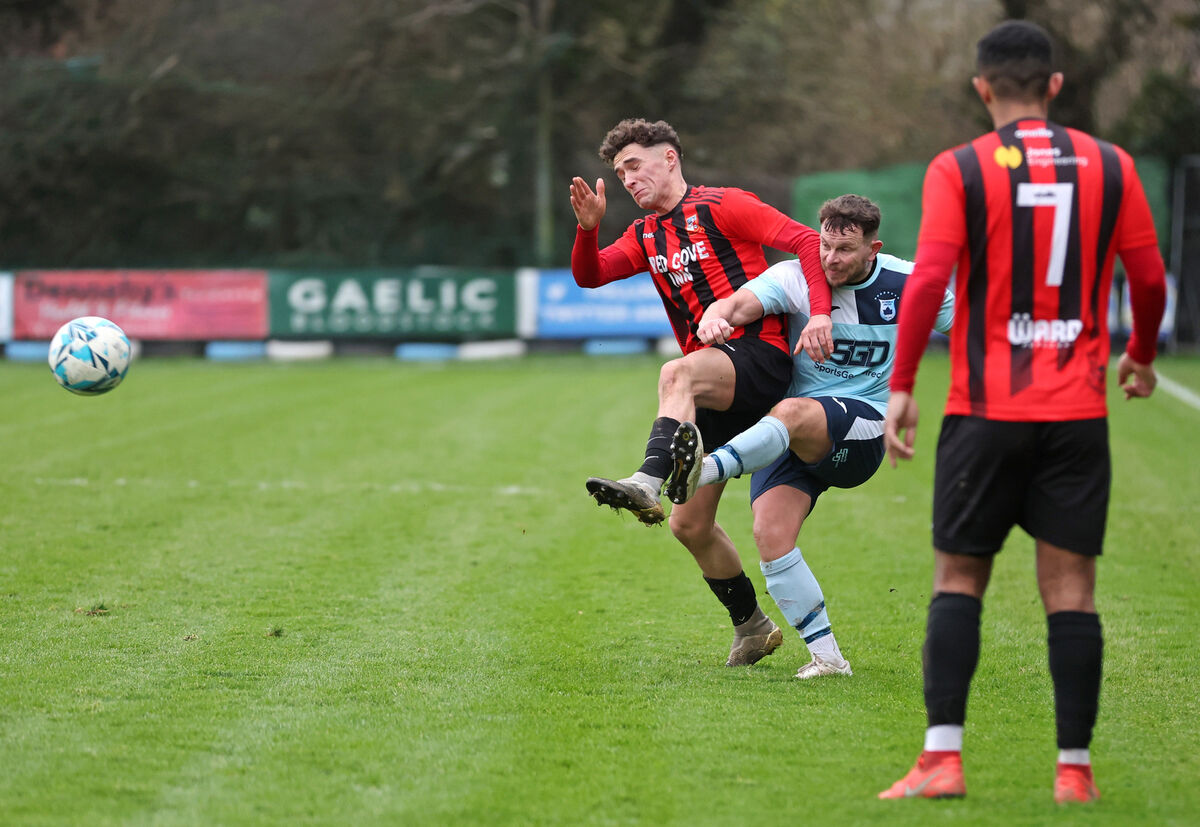 Eoghan Lougheed, Avondale Utd, battles with Jamie O'Sullivan, Ringmahon Rangers. Picture: Jim Coughlan.