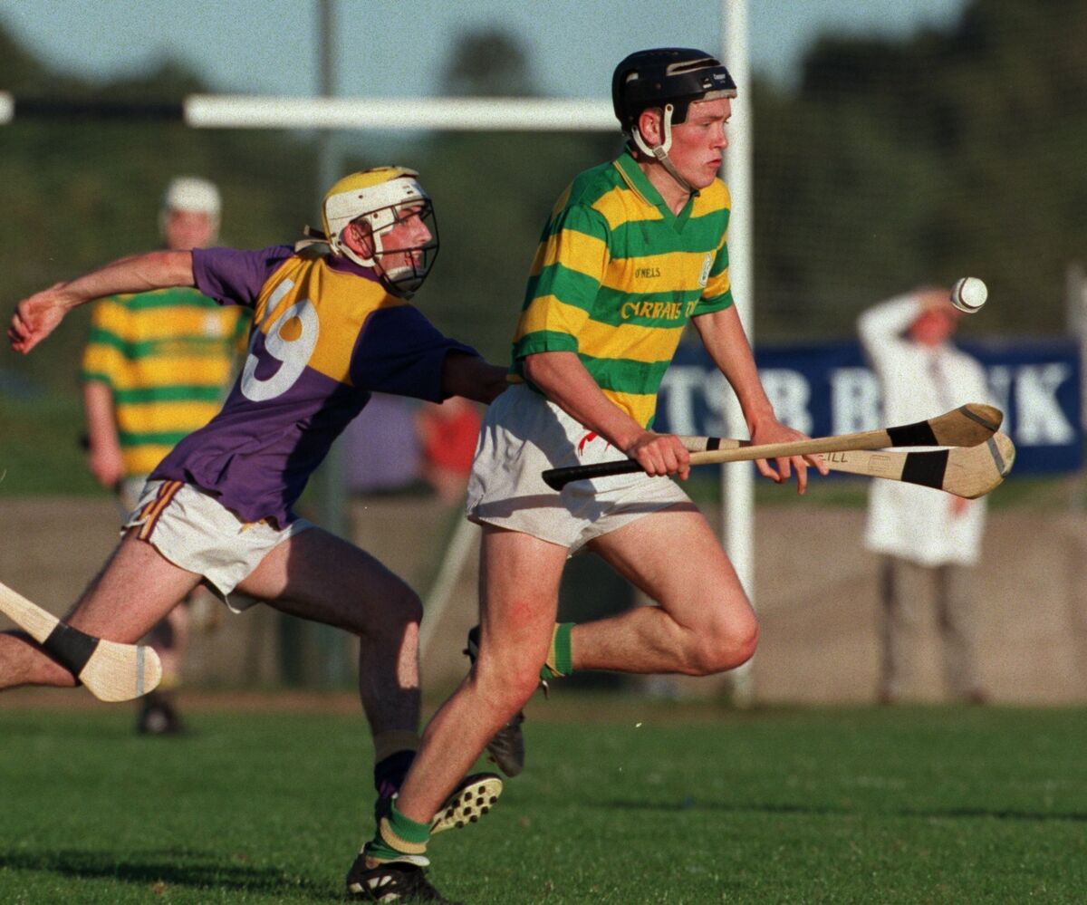 John Browne holds possession despite the attentions of St Catherine's forward Declan O'Neill in the 1998 Cork SHC quarter-final at Carrigtwohill. Picture: Des Barry