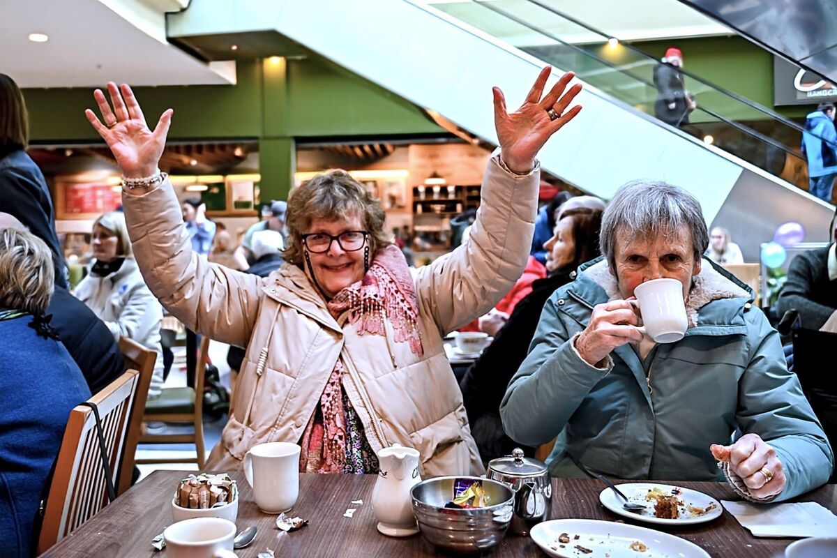 Nancy O’Sullivan from Waterfall enjoys the tea and sing-song hosted by O’Brien’s coffee shop in Mahon Point.  Picture Chani Anderson