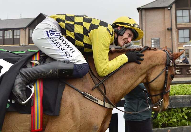 Jockey Paul Townend celebrates winning the Unibet Morgiana Hurdle with horse State Man. Picture: PA Wire