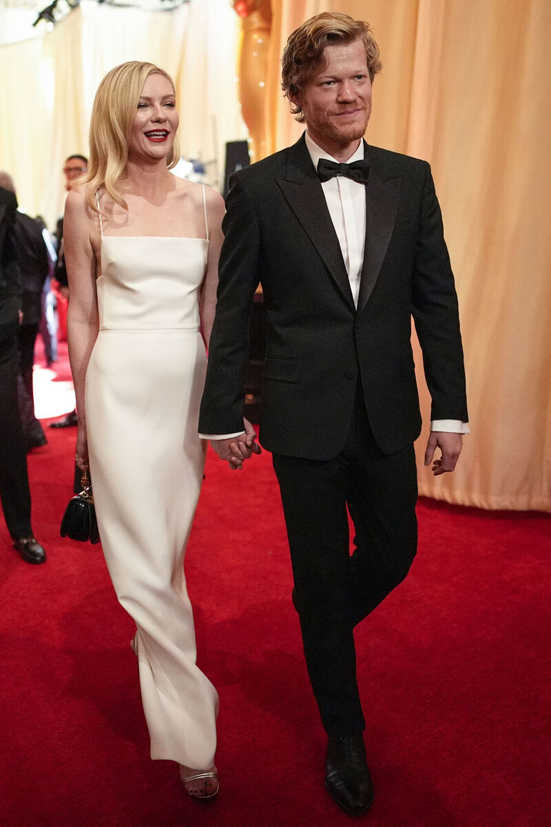 Kirsten Dunst, left, and Jesse Plemons arrive at the Oscars on Sunday. Kirsten Dunst, left, and Jesse Plemons arrive at the Oscars on Sunday.