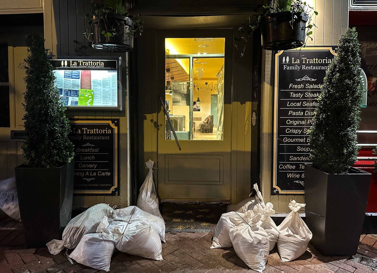  20/10/2023 Cork, Ireland. Businesses all through Midleton are open late tonight, as their owners work to repair damage caused by the flooding of Owennacurra River in time to open to customers tomorrow. Photograph: Eamonn Farrell / © RollingNews.ie.
