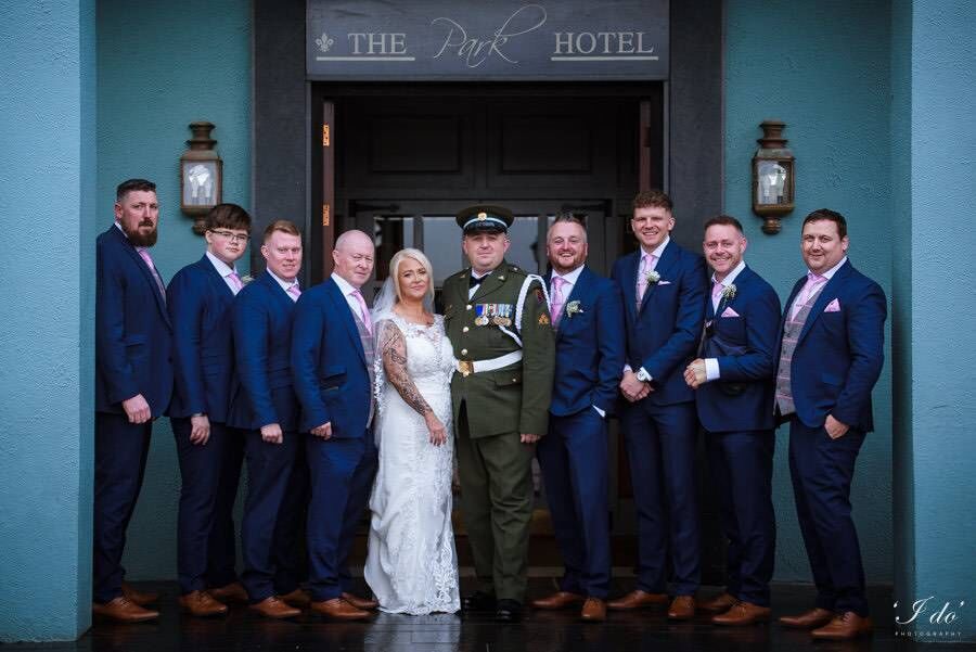 The happy couple with the best man and groomsmen. The happy couple with the best man and groomsmen.
