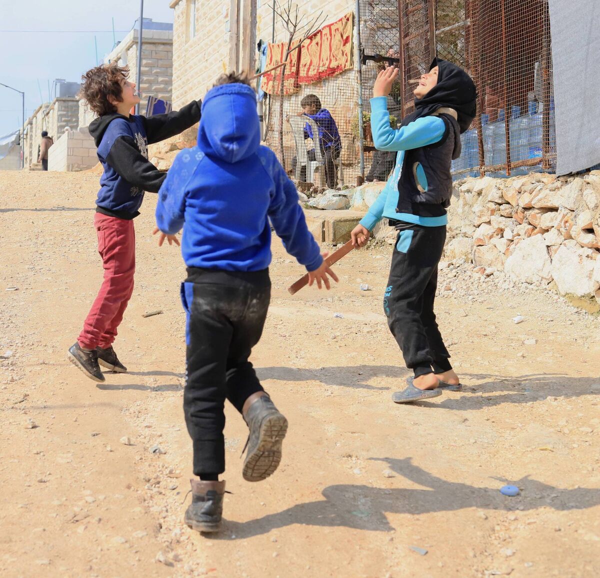 Hamoud’s children are playing in the displacement camp where the family has lived for over a year. Idleb, Syria. February 2024. Hamoud’s children are playing in the displacement camp where the family has lived for over a year. Idleb, Syria. February 2024.