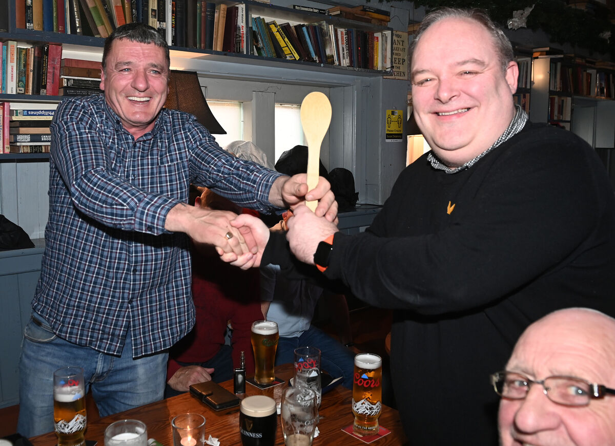 Jason O'Connell (right) presenting the wooden spoon to Kevin Connolly during the Cheltenham Races. Picture; Eddie O'Hare