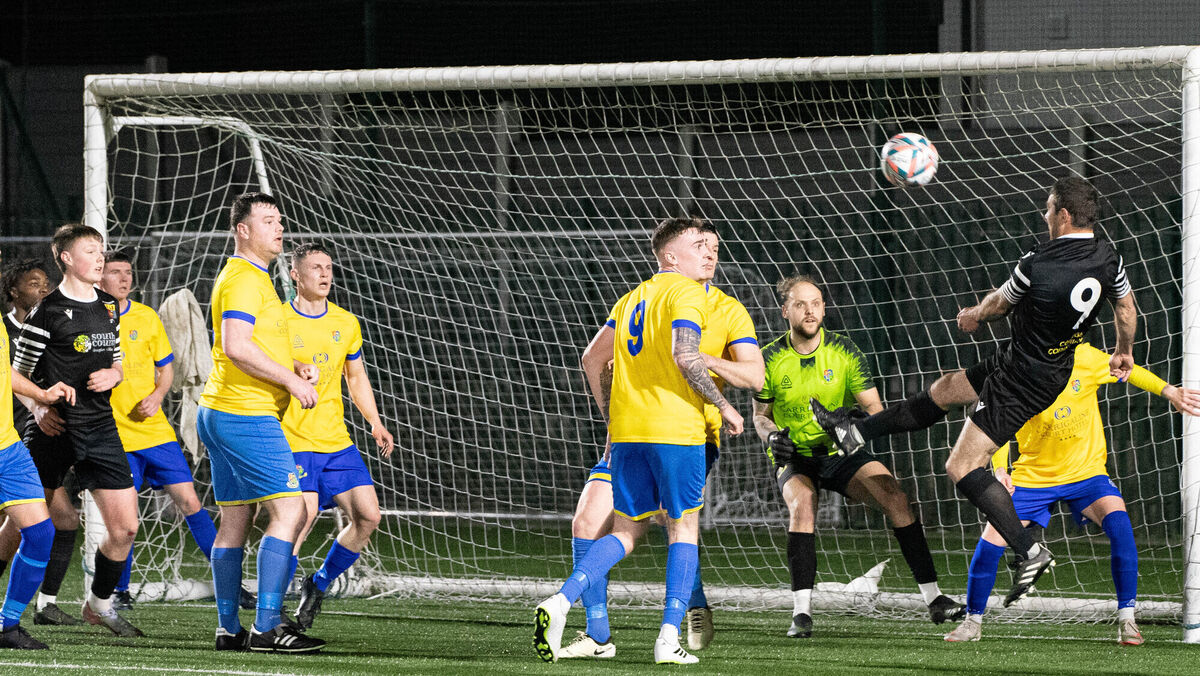 College Corinthians' Mark O'Sullivan (9) heads the ball across the Carrigaline goalmouth. Picture: Howard Crowdy College Corinthians' Mark O'Sullivan (9) heads the ball across the Carrigaline goalmouth. Picture: Howard Crowdy