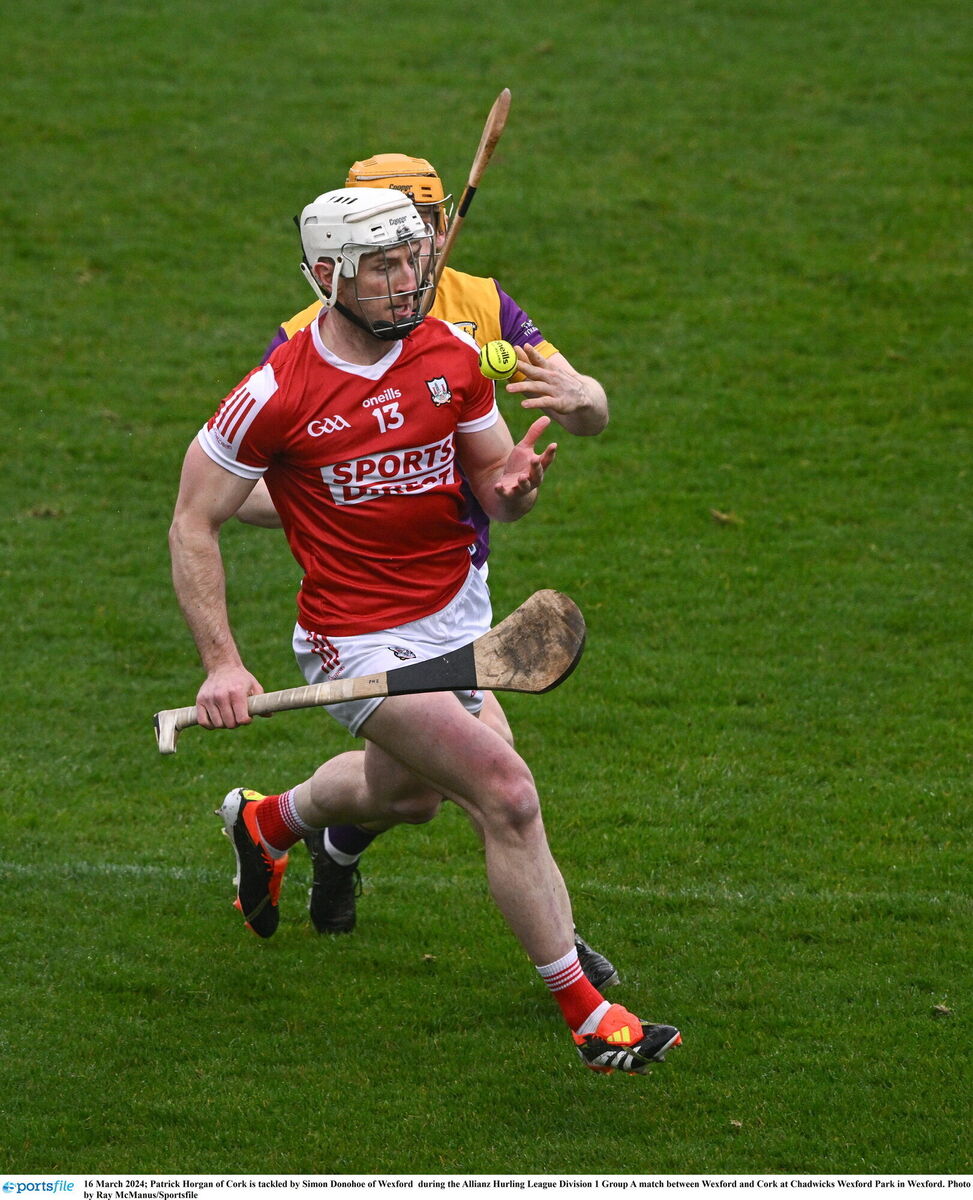 Patrick Horgan of Cork is tackled by Simon Donohoe of Wexford. Picture: Ray McManus/Sportsfile