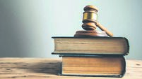 wooden judge on book on the desk