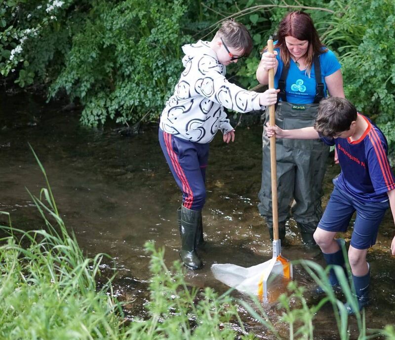 Elaine Moynihane of WiseWater with young people getting involved in citizen science with WiseWater at Ballinspittle river. 