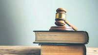 wooden judge on book on the desk