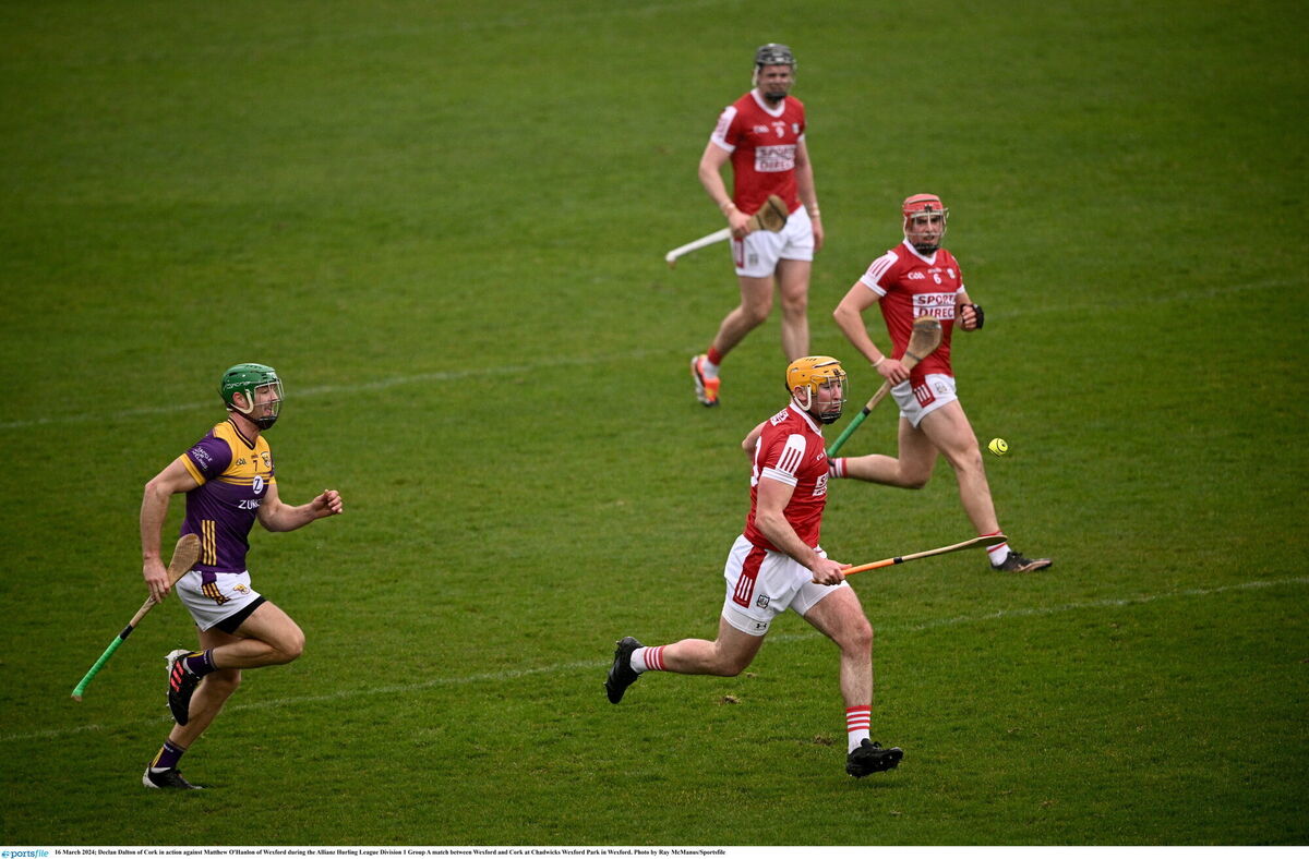 Cork's Declan Dalton races away from Wexford's Matthew O'Hanlon as Darragh Fitzgibbon and Ciarán Joyce provide support. Picture: Ray McManus/Sportsfile