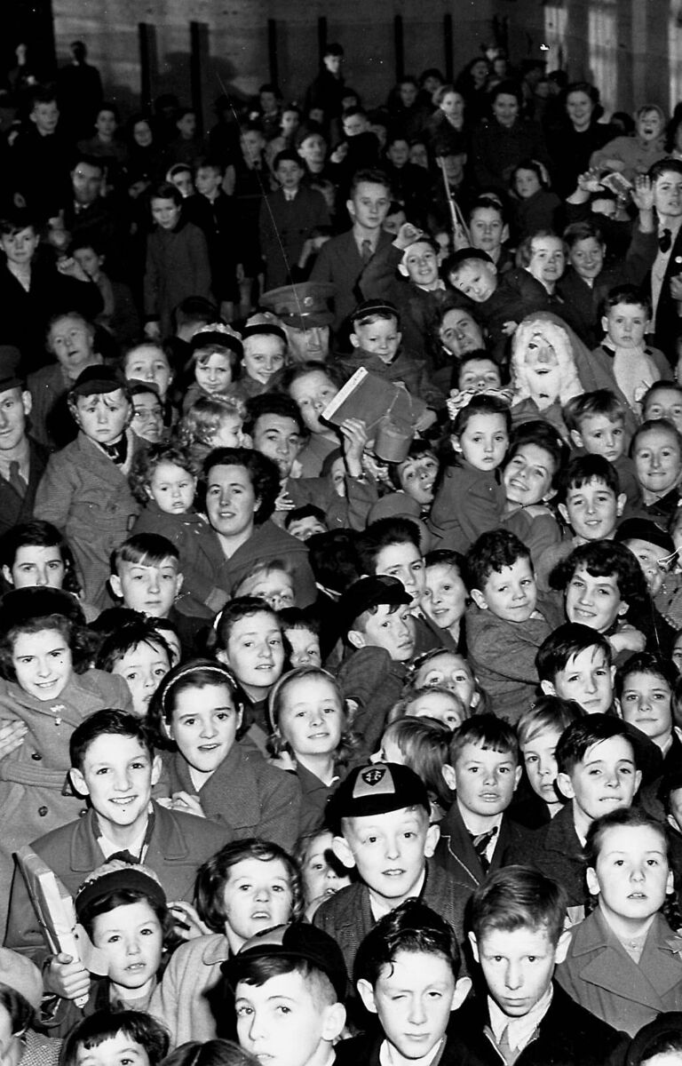 Children at the annual Christmas party held at Collins Barracks on December 20, 1955. A reader who lived on site recalls the parties that were held there in the 1940s in the Gymnasium.