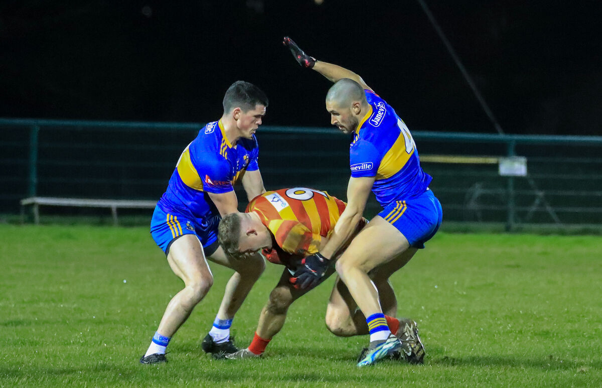 Carrigaline's David Griffin and Niall Quirke challenge Newcestown's Gearoid O'Donovan. Picture: David Creedon