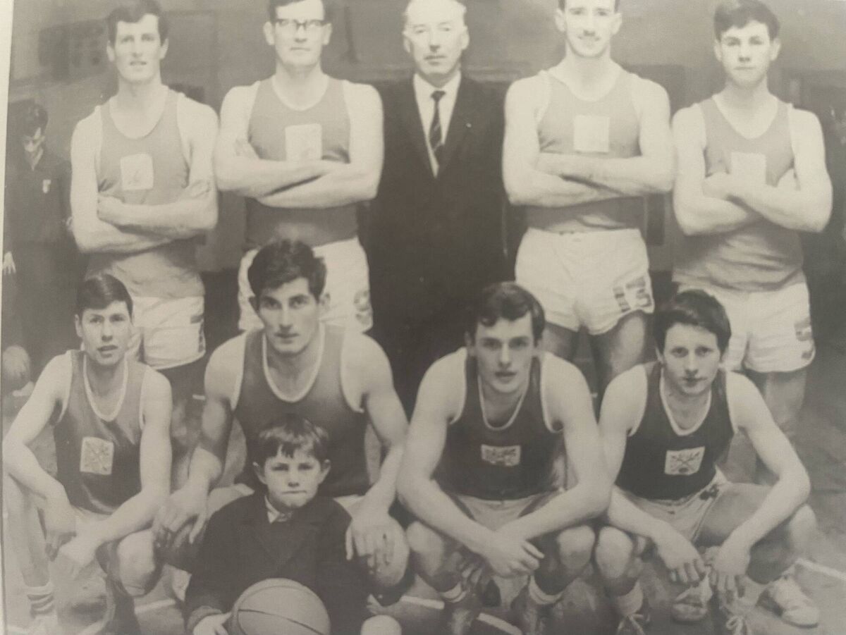 A Neptune Team from the early 1970s, (back row) Jim O'Connell, Niall O’Riordan, Donal O’Donoghue, Dave O’Leary and Junior Ryan. (Front row) Micheal Finn, Leo O’Donoghue, (young Terence Ryan with the basketball), Micheal Foley and Willie McDonnell.