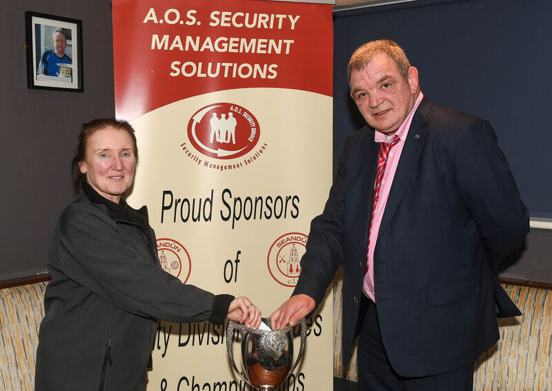  Jess O'Sullivan, sponsor and Mick Buckley, chairman, making the draw for the AOS Security Seandun Junior championship, at Brian Dillon’s GAA Club.