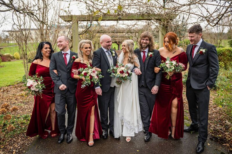 The couple with their wedding party, made up of family and close friends, who were by their side for their special day. The couple with their wedding party, made up of family and close friends, who were by their side for their special day.