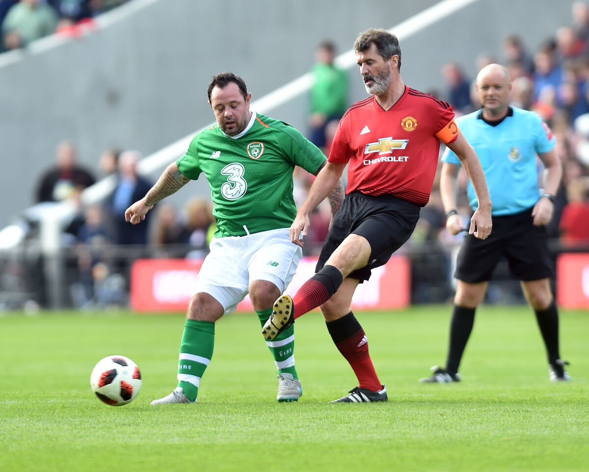 Manchester United's Roy Keane clears from Ireland's Andy Reid at the Liam Miller tribute match at SuperValu Páirc Uí Chaoimh. Picture: Eddie O'Hare Manchester United's Roy Keane clears from Ireland's Andy Reid at the Liam Miller tribute match at SuperValu Páirc Uí Chaoimh. Picture: Eddie O'Hare