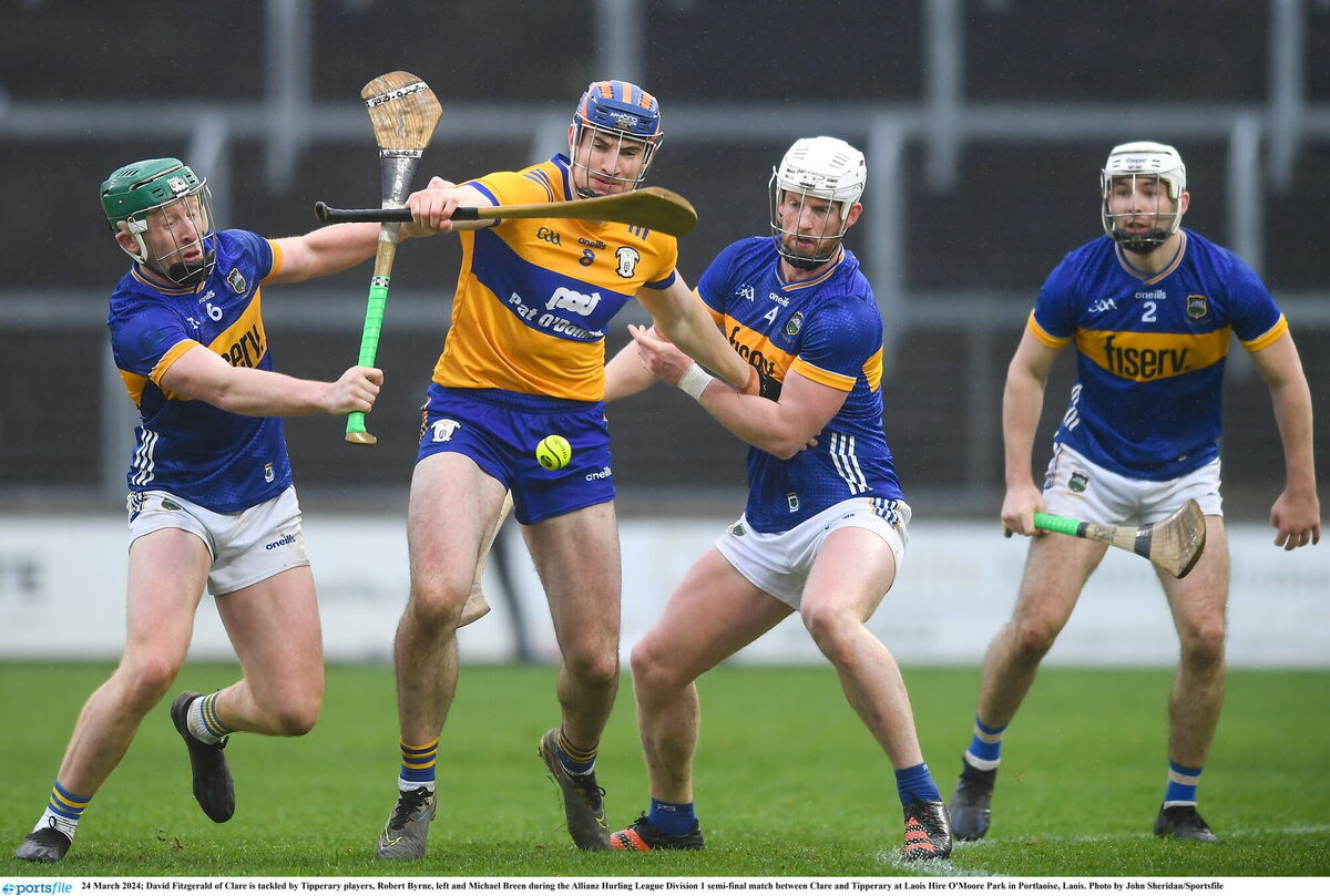 David Fitzgerald of Clare is tackled by Tipperary's Robert Byrne and Michael Breen on Sunday. Picture: John Sheridan/Sportsfile