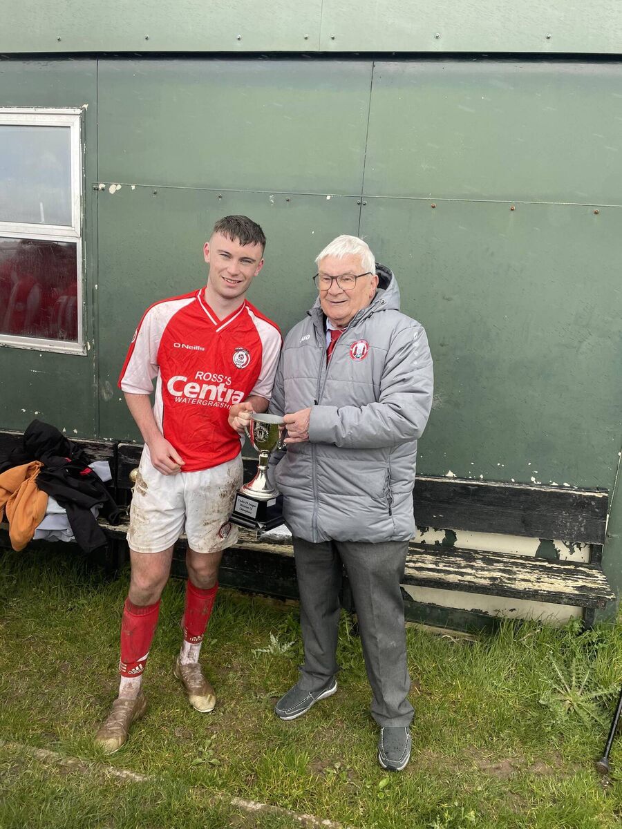 Mr Christy Byrne of the Cork Youth League presenting the U19 League 1 Trophy to Callum O’Mahony after their game against Corkbeg at Skehangh Park last Saturday morning.