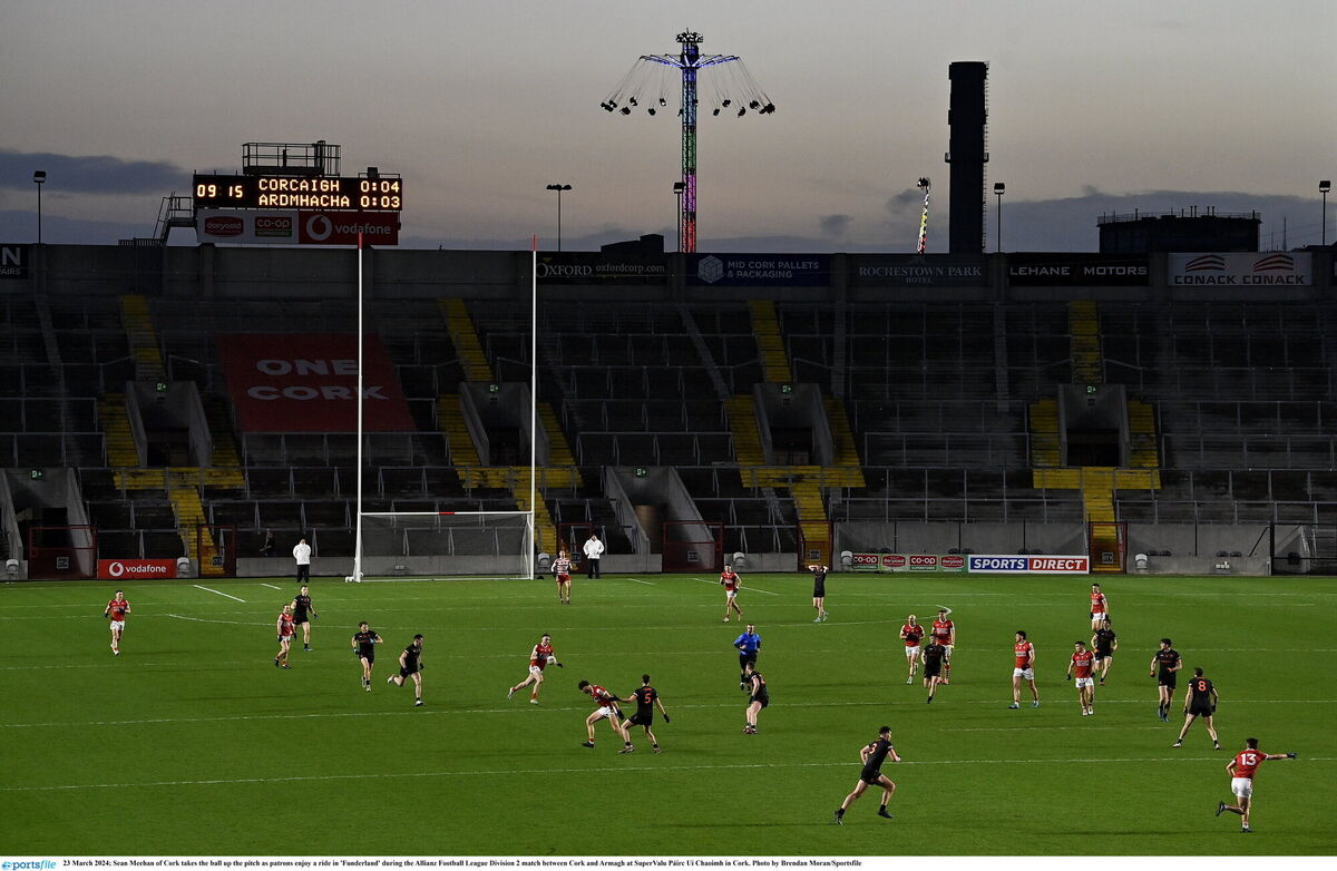 Seán Meehan takes the ball up the pitch as patrons enjoy a ride in 'Funderland' during Cork v Armagh last Saturday at SuperValu Páirc Uí Chaoimh. Picture: Brendan Moran/Sportsfile