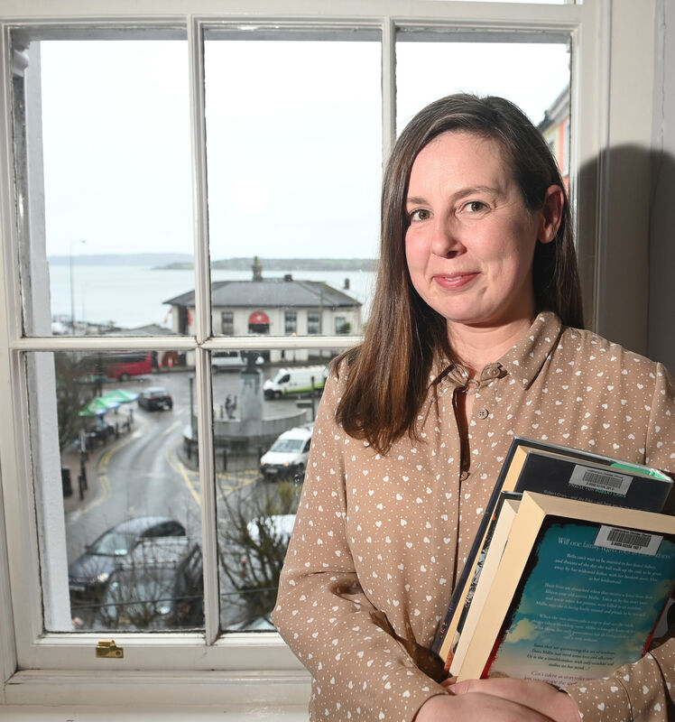 Julie O'Donnell, assistant librarian, with the views over Cork harbour from Cobh library. Picture; Eddie O'Hare