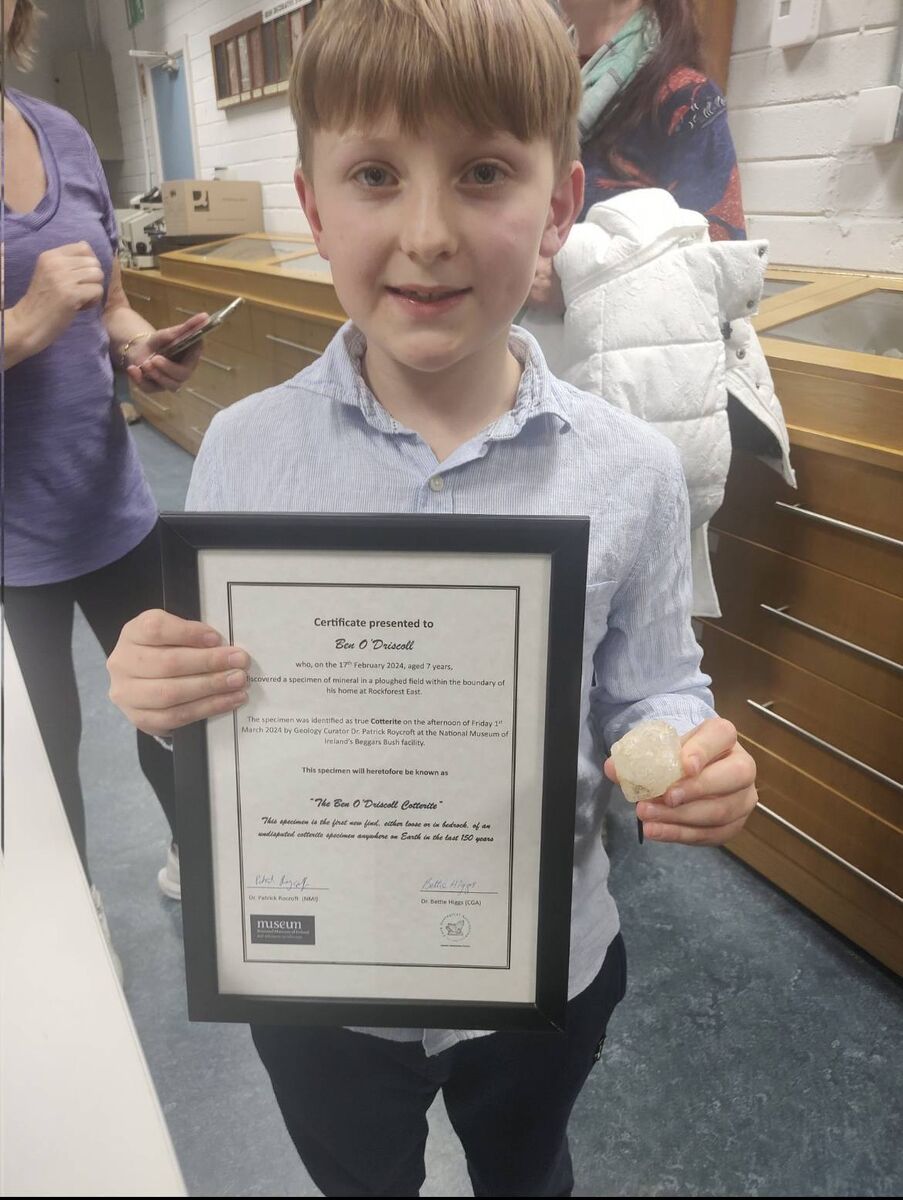 Ben O'Driscoll (7) from Rockforest near Mallow in Co Cork, with his certificate saying his find will forever be known as 'The Ben O'Driscoll Cotterite'. (Picture: Karl Grabe) Ben O'Driscoll (7) from Rockforest near Mallow in Co Cork, with his certificate saying his find will forever be known as 'The Ben O'Driscoll Cotterite'. (Picture: Karl Grabe)