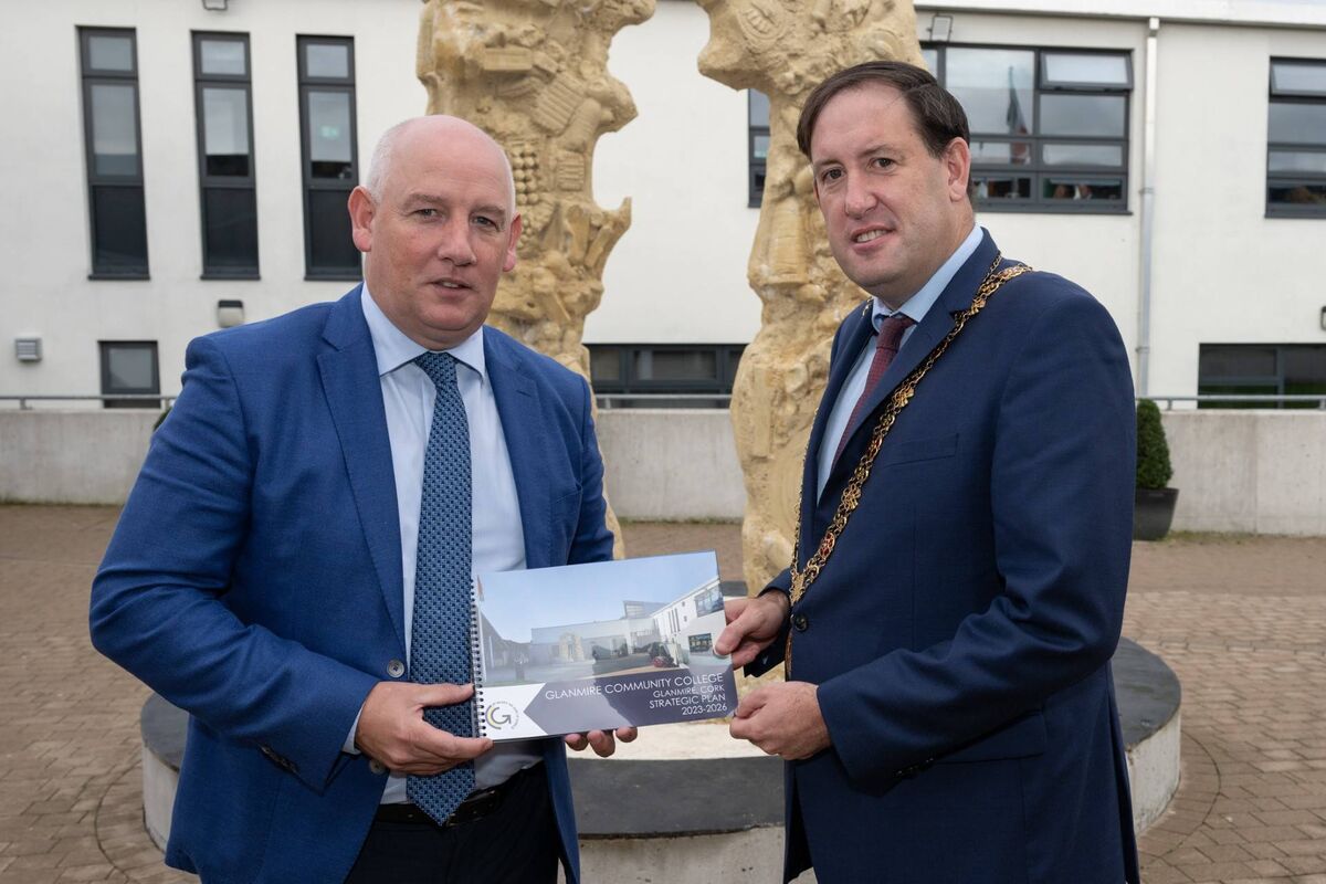 Ronan McCarthy, Glanmire Community College principal, presenting the Lord Mayor of Cork Cllr Kieran McCarthy with a strategic plan booklet of the school. 