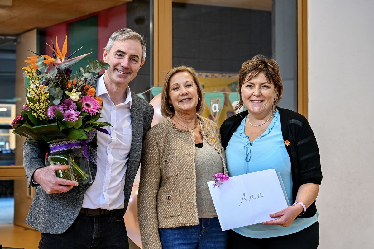 School principal Dan O’Connor and Regina Kelleher pictured presenting Ann O’Donovan with gifts at her retirement party. Picture: Chani Anderson. School principal Dan O’Connor and Regina Kelleher pictured presenting Ann O’Donovan with gifts at her retirement party. Picture: Chani Anderson.