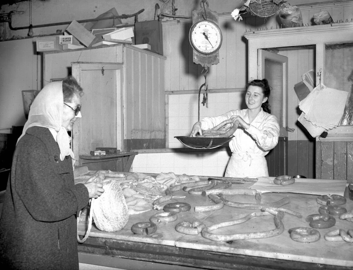 A customer at O'Reilly's tripe and drisheen shop, St. Philomena's Road, Gurranebraher, in 1953.
