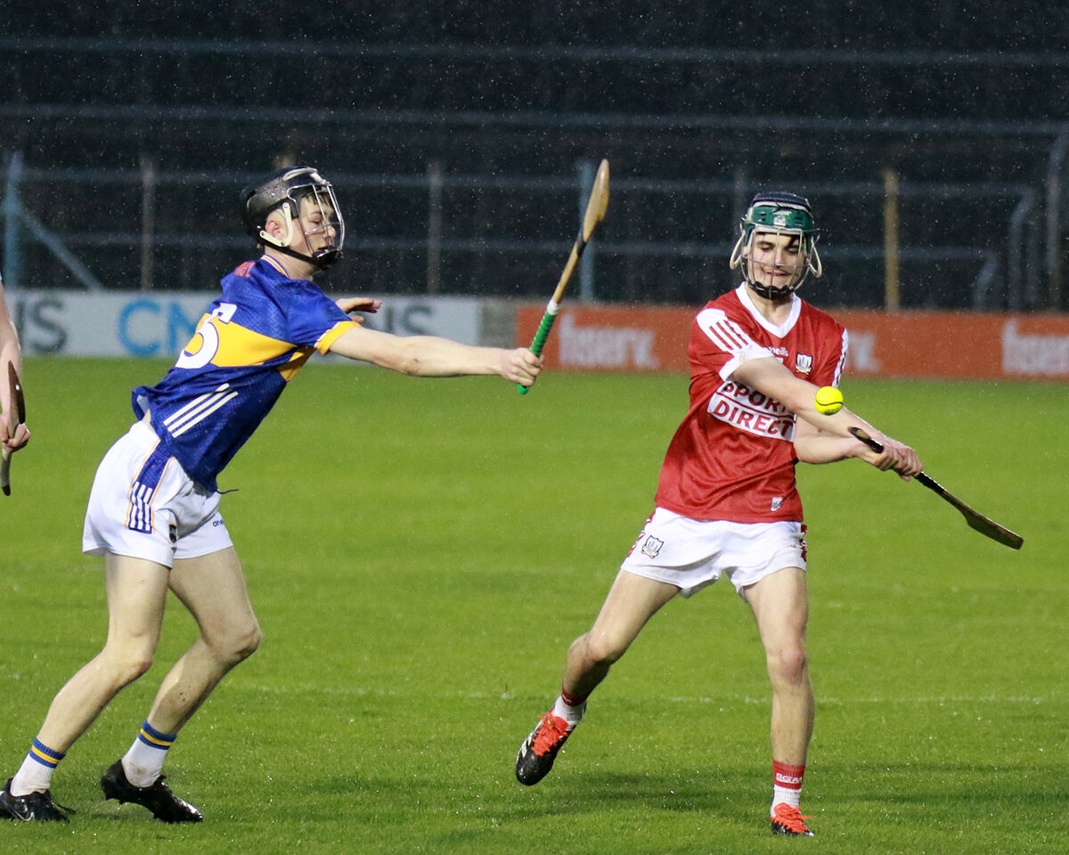 Dean Cosgrave of Cork clears despite the attentions of Tipperary's Jake Donelan Houlihan. Picture: Brendan Gleeson