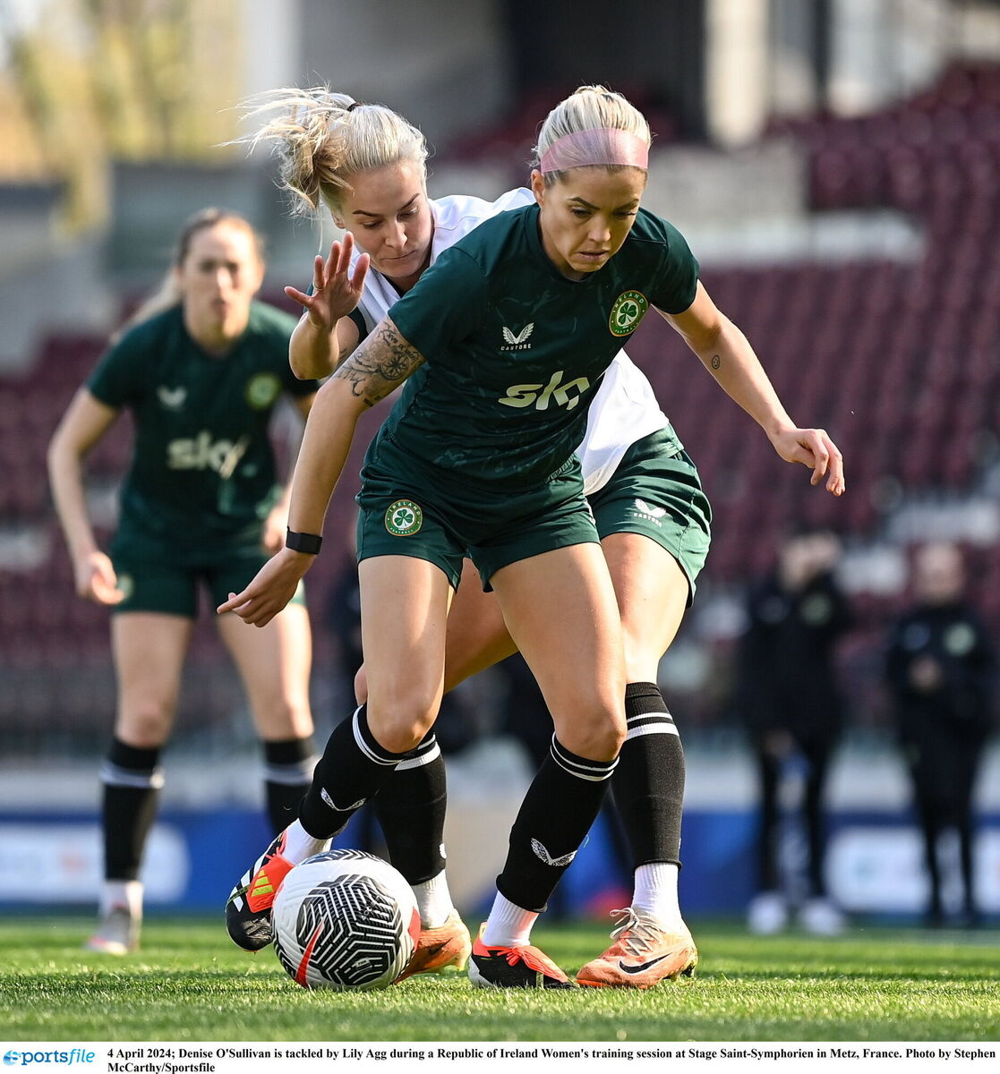 Denise O'Sullivan is tackled by Lily Agg during a Republic of Ireland Women's training session at Stage Saint-Symphorien in Metz, France. Photo by Stephen McCarthy/Sportsfile