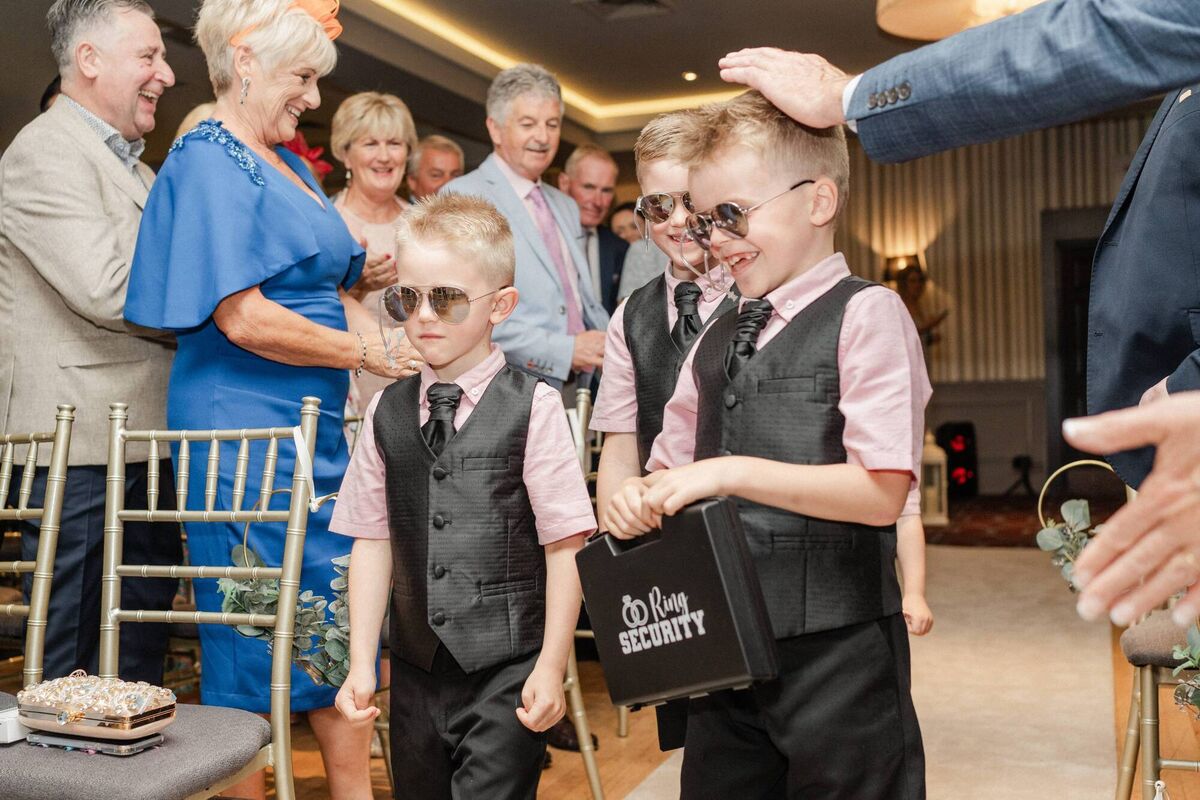 The couple’s eldest son and Natalie’s nephews walked up the aisle as ‘ring security’ to AC/DC, while her two nieces followed up in a pink mini that said ‘Here comes my Auntie’.