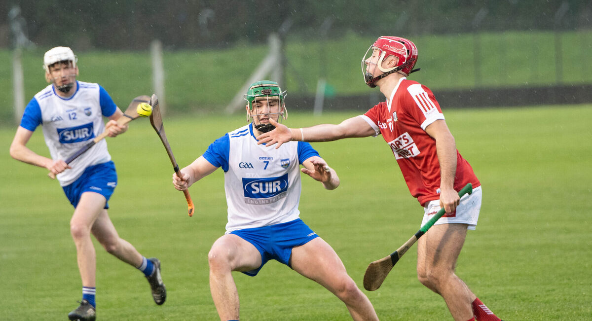 Cork's William Buckley gets his pass away despite the attentions of Waterford's Fionn Hallinan. Picture: Howard Crowdy Cork's William Buckley gets his pass away despite the attentions of Waterford's Fionn Hallinan. Picture: Howard Crowdy