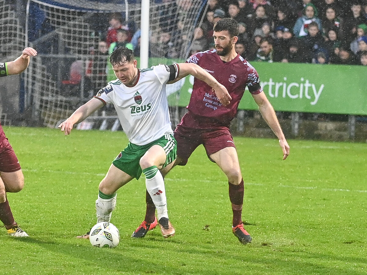  Cork City's Cian Murphy keeps possession as Cobh Ramblers' Brendan Frahill closes in during their SSE Airtricity League First Division clash at Turner's Cross.