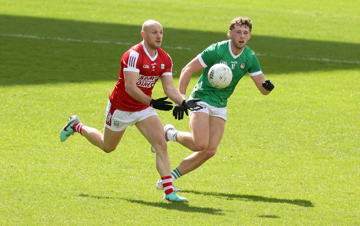 Cork vs Limerick: Cork's Brian O'Driscoll is challenged by Cathal Downes of Limerick