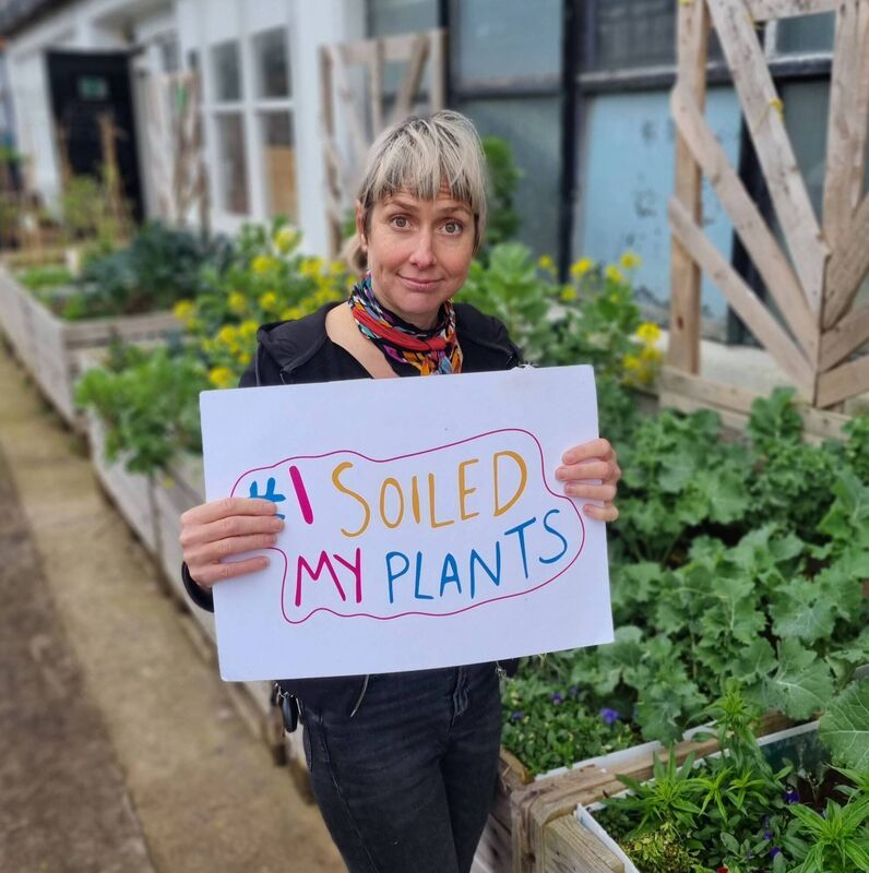 Virginia O Gara with 'I soiled my plants' sign in front of a CUSP bed. Virginia O Gara with 'I soiled my plants' sign in front of a CUSP bed.