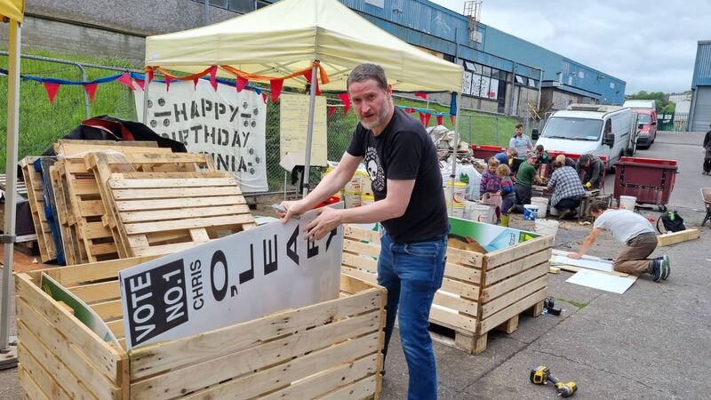 Albert Twoomey building CUSP beds from recycled pallets and election posters. Albert Twoomey building CUSP beds from recycled pallets and election posters.