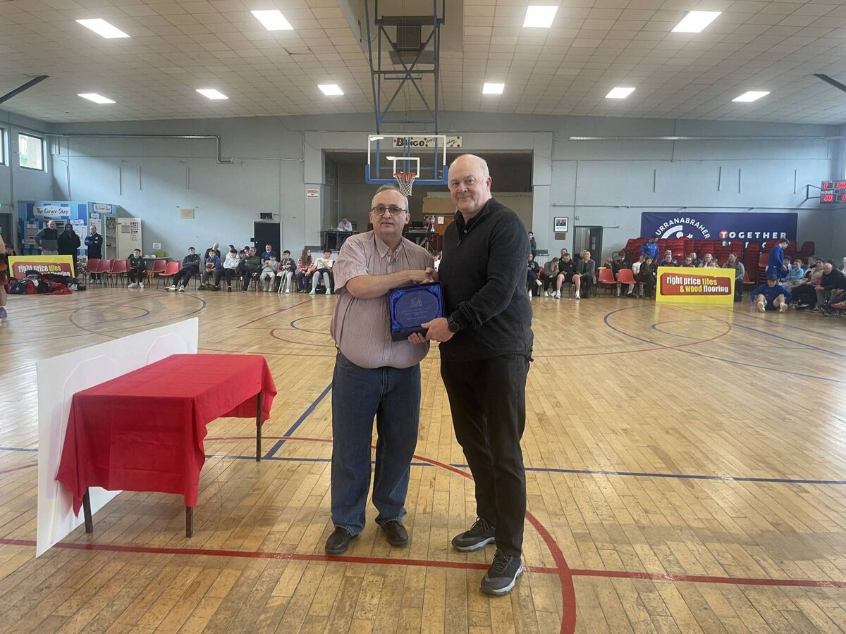 Willie McCarthy, chairman CCBB presents a Hall of Fame award to Sean Murphy, (son of Vincent), Kanturk Basketball club at the GCU Arena. 