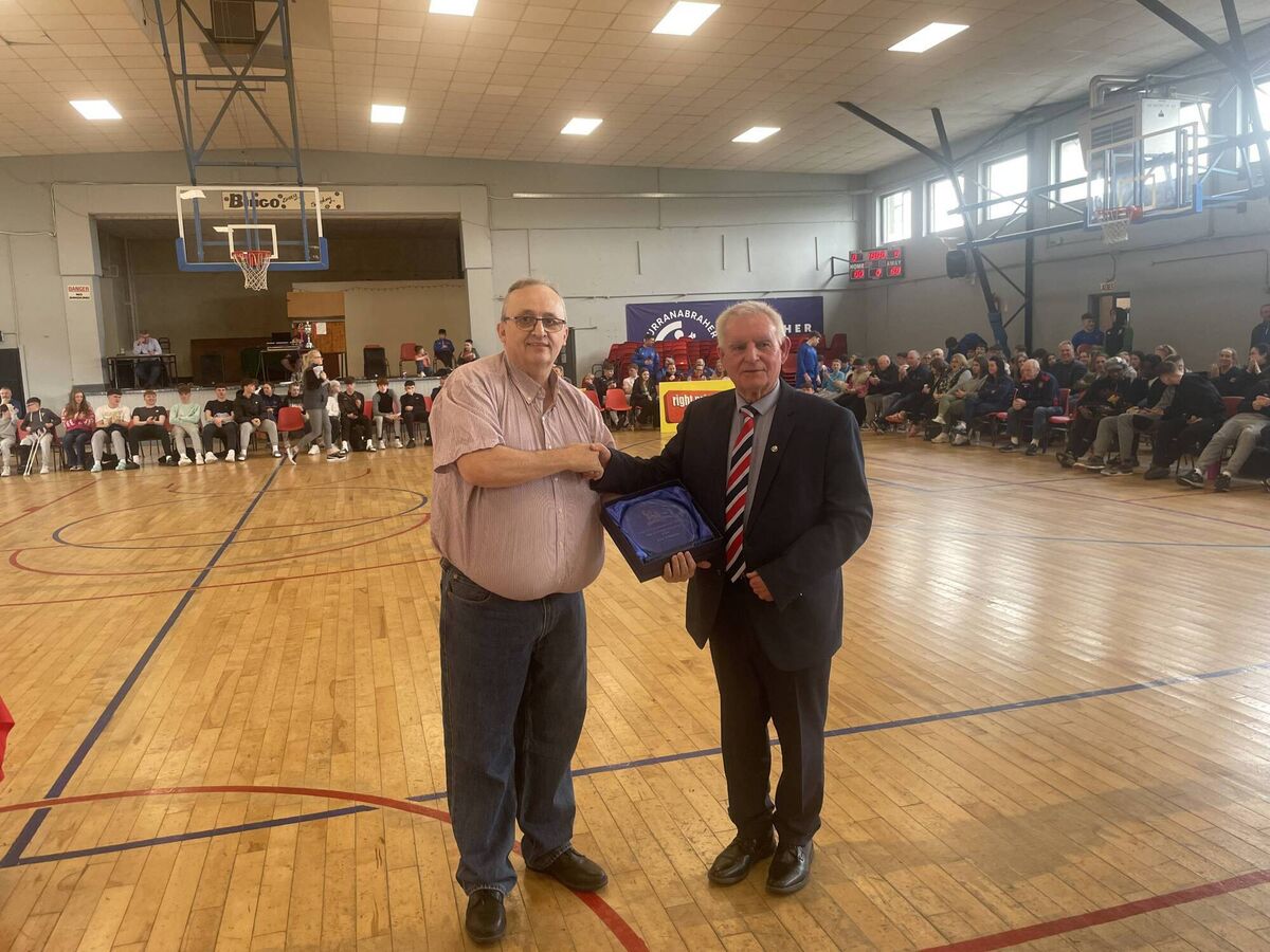 Willie McCarthy, chairman CCBB presents a Hall of Fame award to Joe Aherne, Neptune Basketball club at the GCU Arena. 