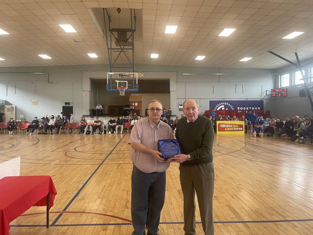 Willie McCarthy, chairman CCBB presents a Hall of Fame award to Michael O'Sullivan, Blue Demons Basketball club at the GCU Arena. 