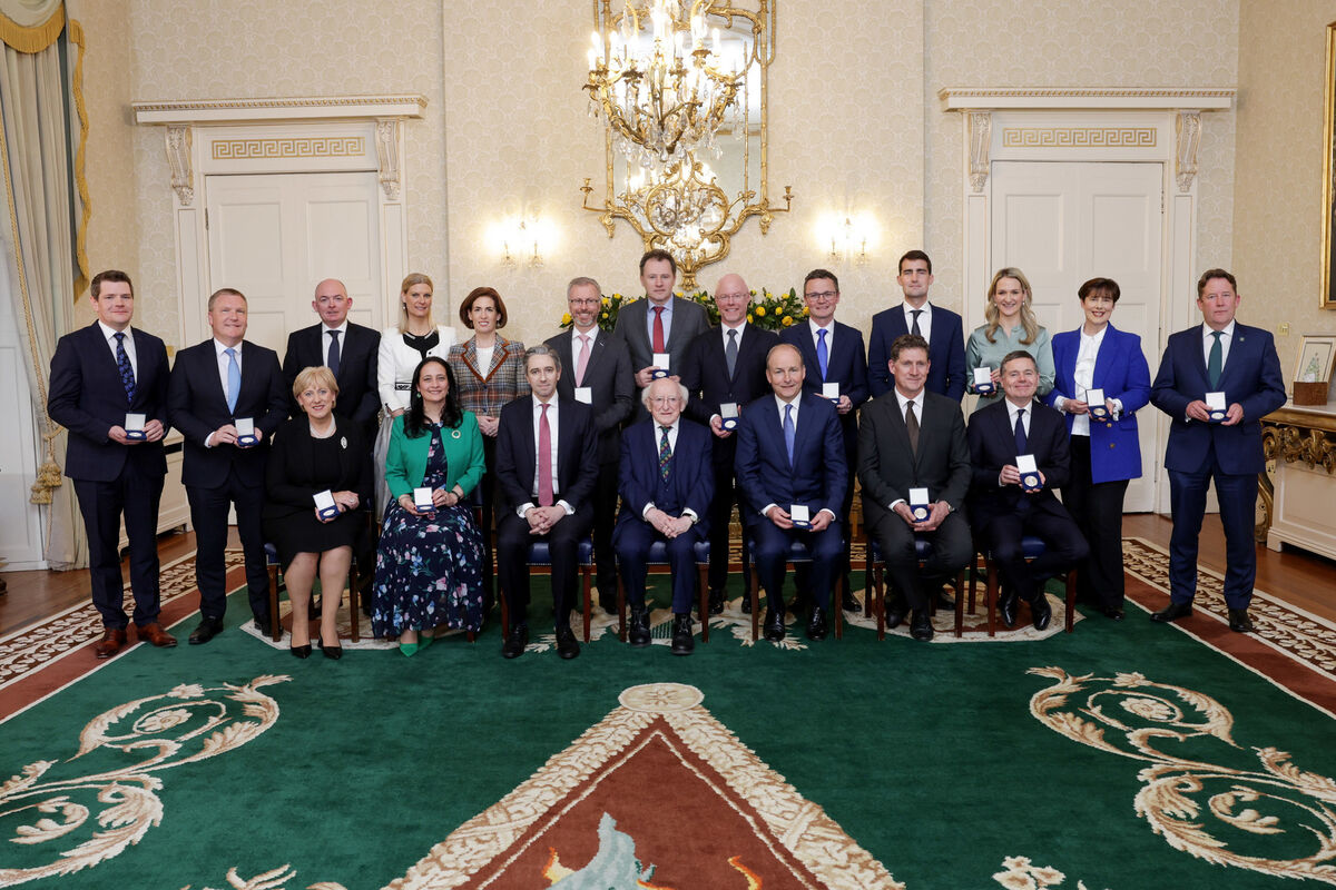 President of Republic of Ireland Michael D Higgins and newly elected Taoiseach Simon Harris with the new Government Cabinet at Aras an Uachtarain, Dublin, where the President presented new ministers with their Seal of Office. Photo: Maxwells/PA Wire President of Republic of Ireland Michael D Higgins and newly elected Taoiseach Simon Harris with the new Government Cabinet at Aras an Uachtarain, Dublin, where the President presented new ministers with their Seal of Office. Photo: Maxwells/PA Wire