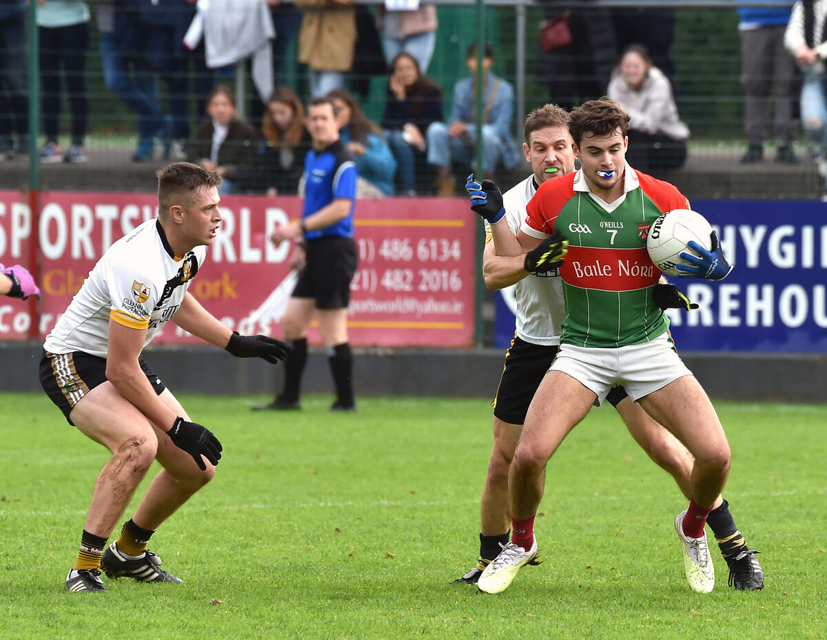 Ballinora's Ivan Quirke under pressure from Glenville players Daire O'Leary and Eddie Delhaunt during their IAFC relegation play-off match at Riverstown last year. Picture: Dan Linehan